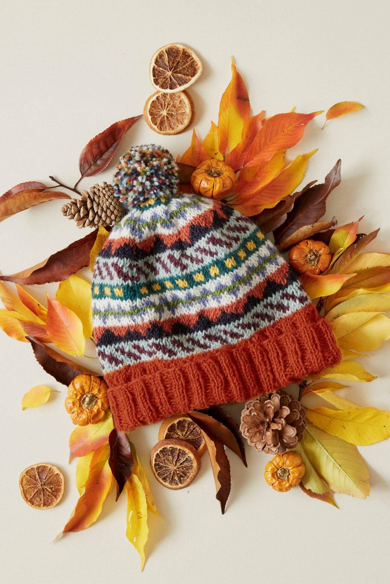 Wool Bobble Hat in Multi Rust Orange