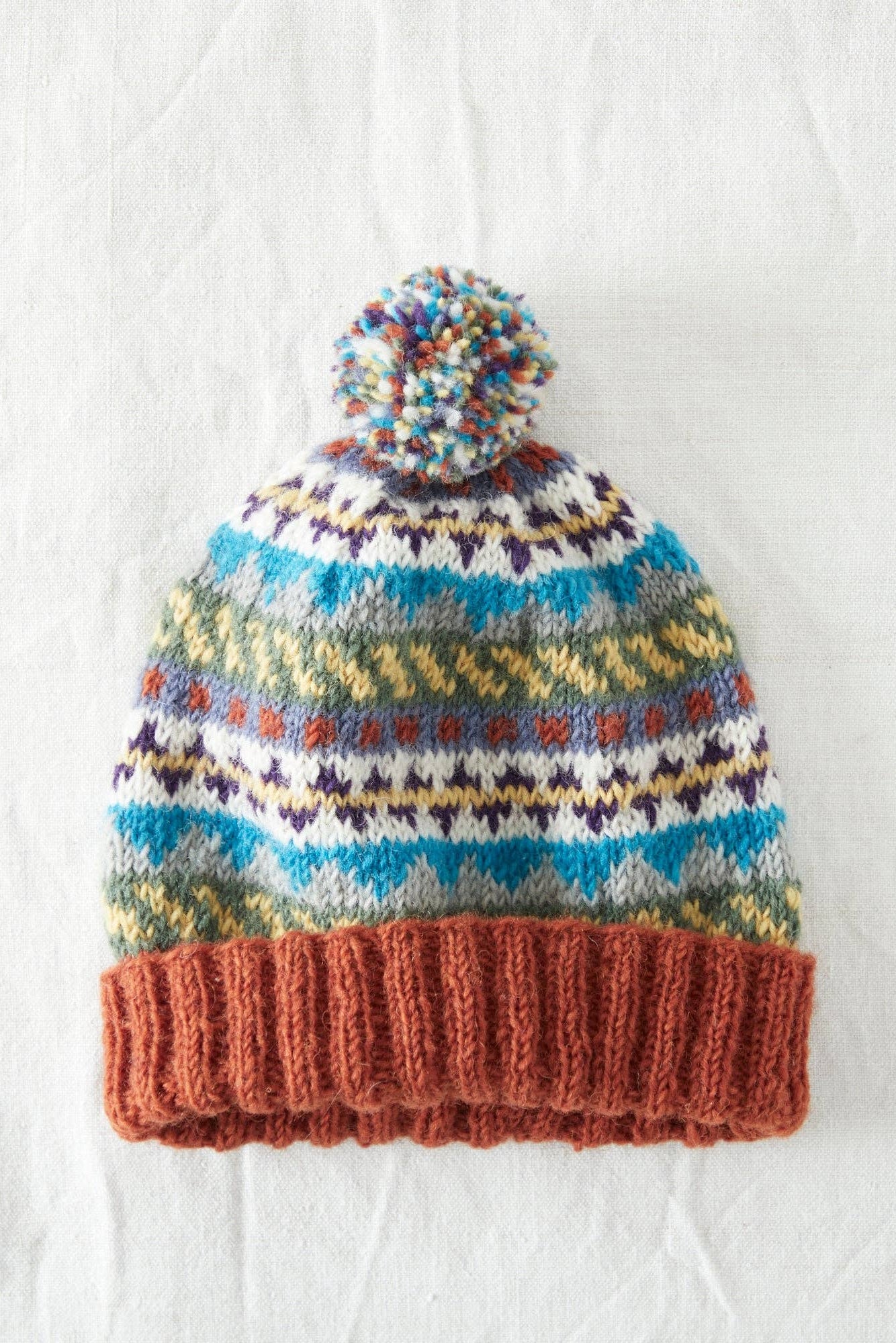Wool Bobble Hat in Multi Rust Orange